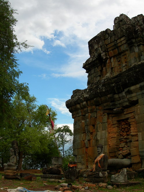 Buddha statue in front of temple. Angkor, Cambodia.