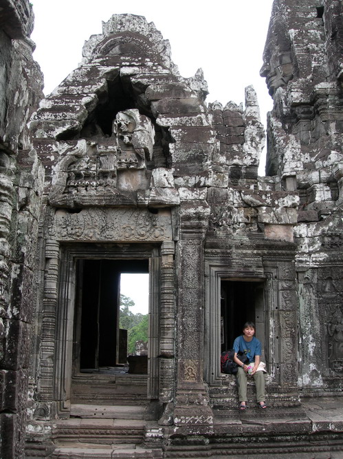Kerry in Bayon temple. Angkor, Cambodia.