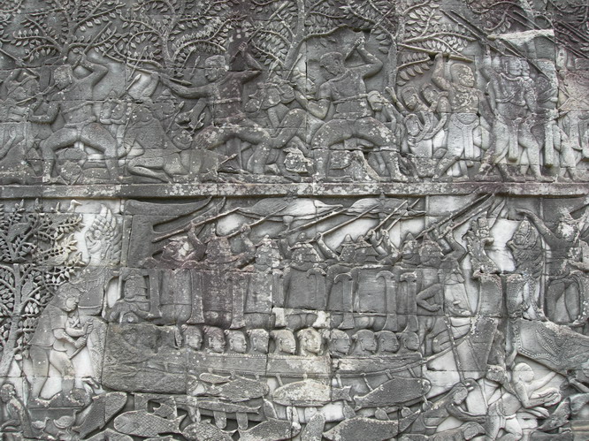 A detail from a large wall panel, that tells of  every day Cambodian life. Angkor, Cambodia.