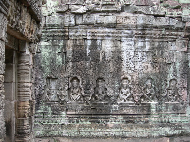 Detailed carving of meditators. Angkor, Cambodia.