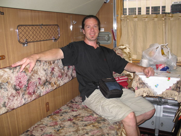 Inside the train compartment. There are 4 people to one compartment.