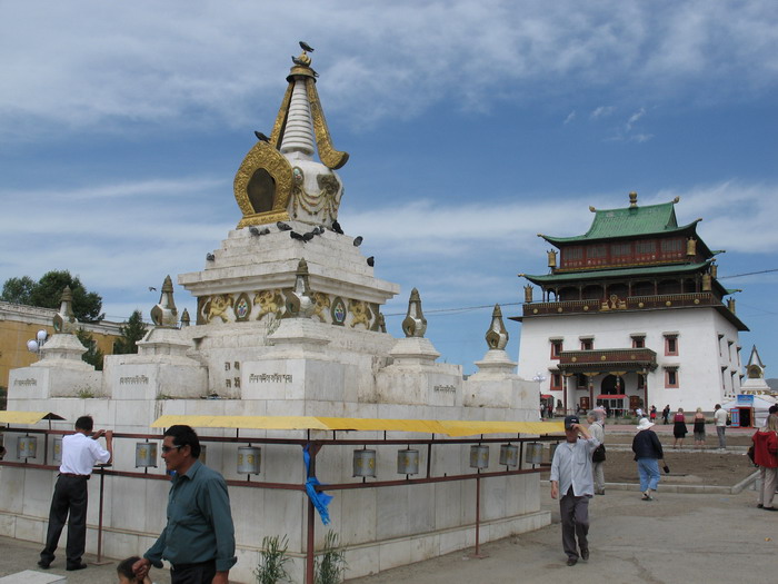 Mongolians walking around a stupa at Ganden Monastery, Ulan Bator, Mongolia.