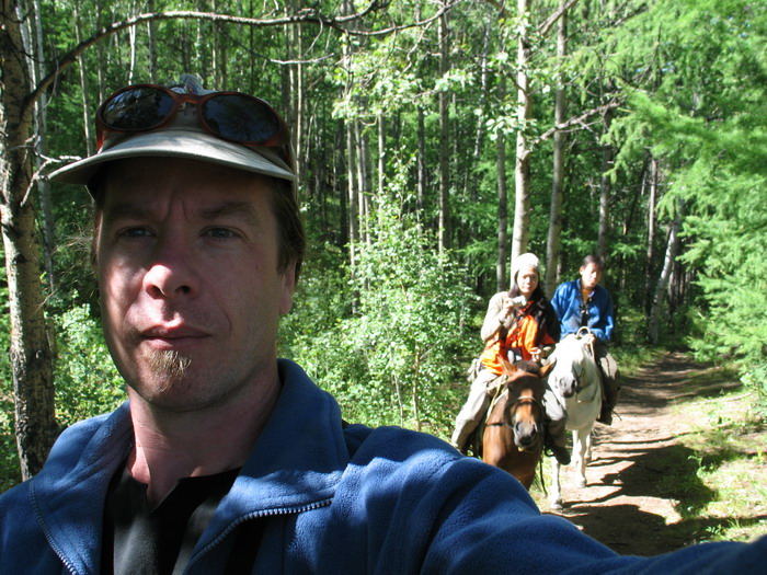 Ray taking a self-portrait while on horse back.