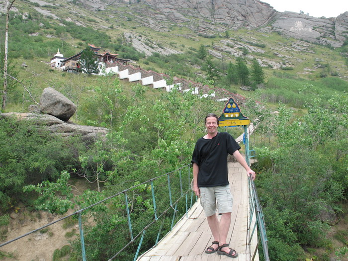 Ray crossing a small bridge to get to a local monastery.