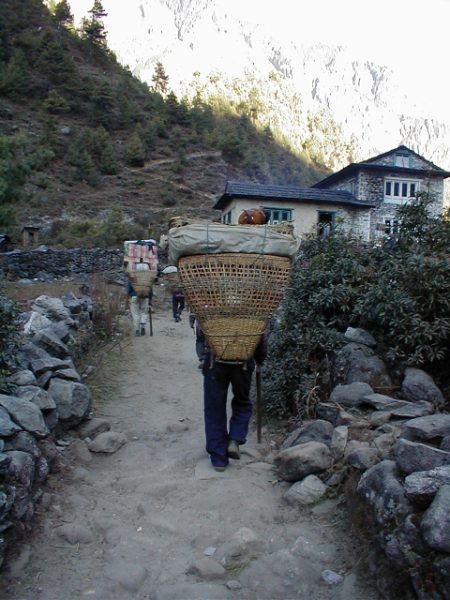The porters are the life line of the Everest region. They carry in just about everything from bottles of Tuborg beer to cases of instant noodles on their backs.