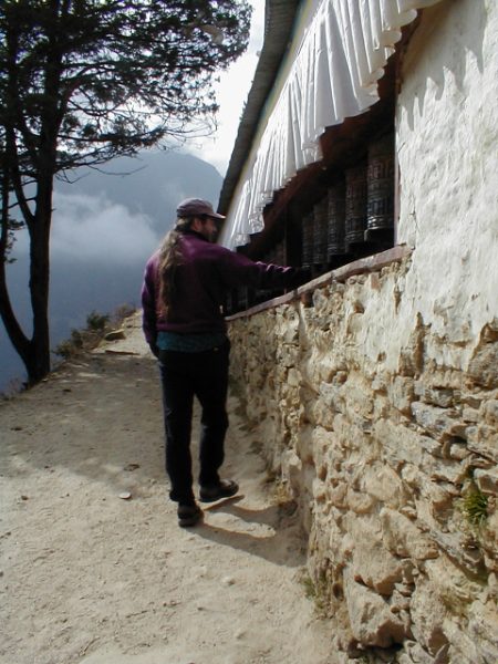 Ray spins prayer wheels at a local monastery.