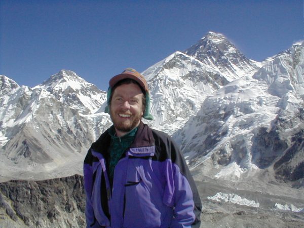 Ray in front of Mt. Everest (right-center).