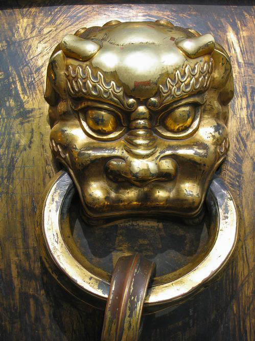 Detail from a large metal pot in the Forbidden City