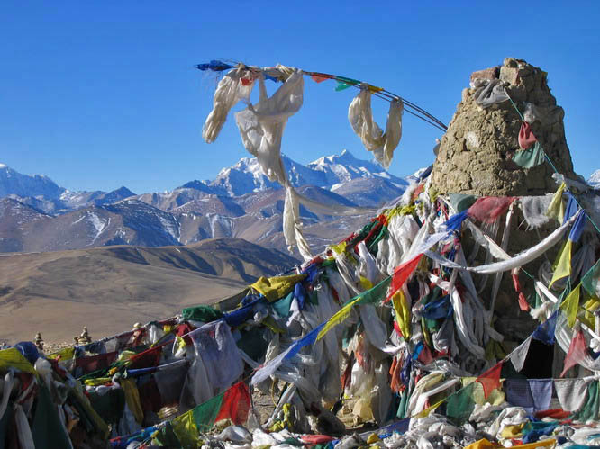 Prayer flags in front of the Himalaya. La Lung La,, Central Tibet.