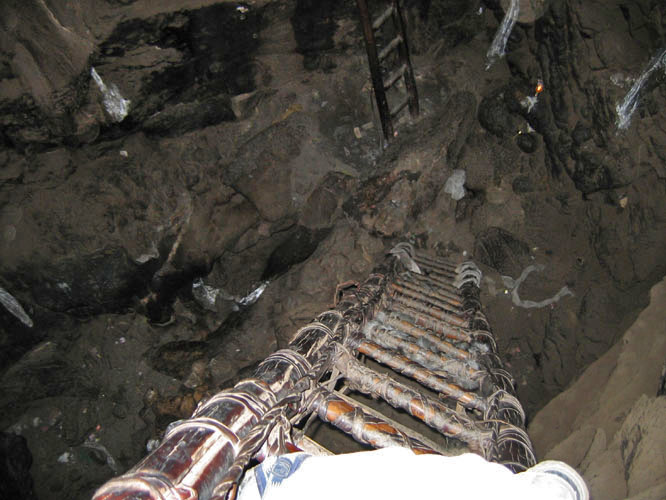 Climbing down into the main cave.