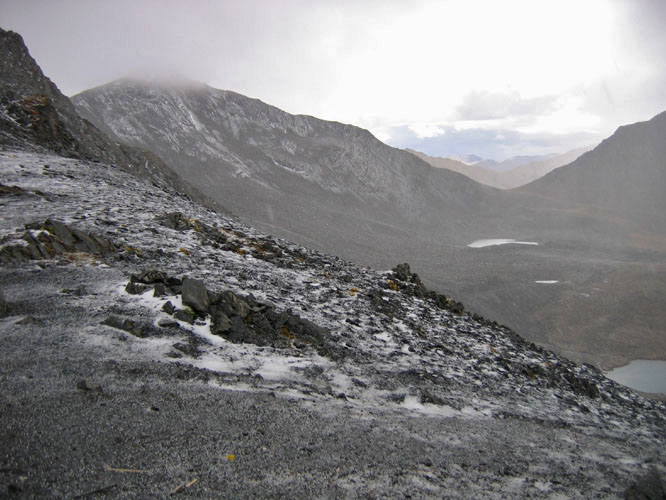 It was 2 days of walking to cross the pass and by the time I got to the top, I was hit with a small snow and ice storm.