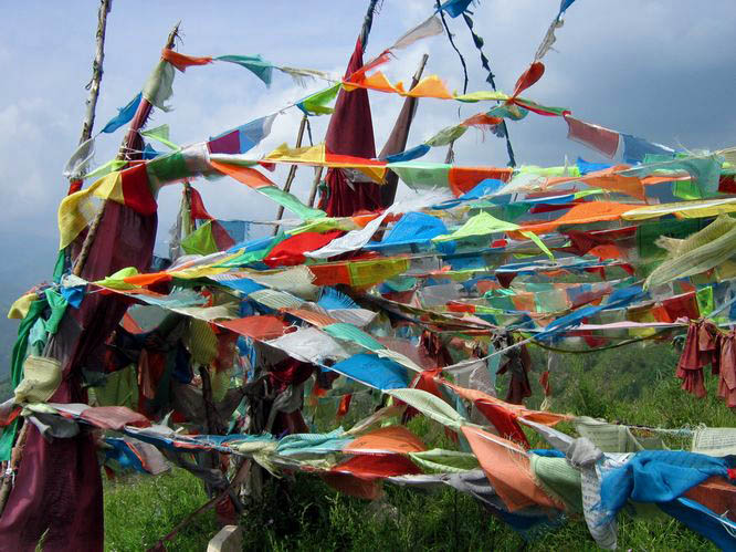 Tibetan prayer flags on top of a hill.