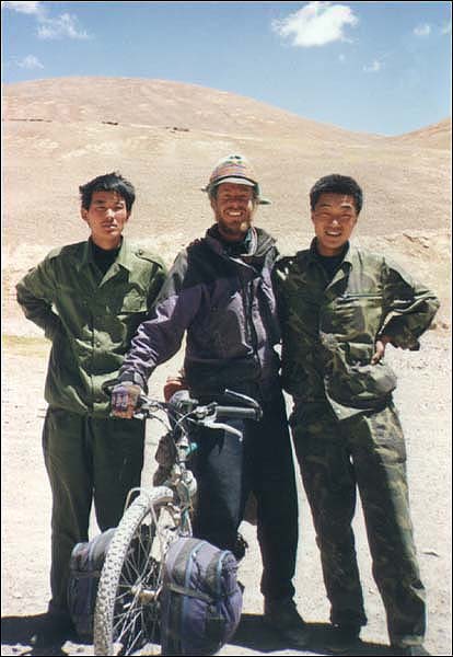 Two Chinese People's Liberation Army soldiers that stopped to see what a white boy was doing alone in far Western Tibet.