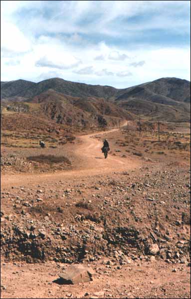 Lone horse rider near Markam, Eastern Tibet