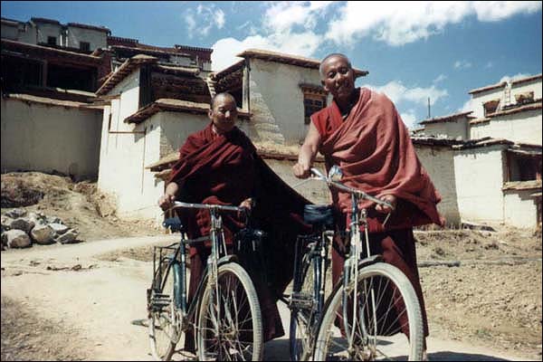 Two monks going out for a bike ride in Eastern Tibet.