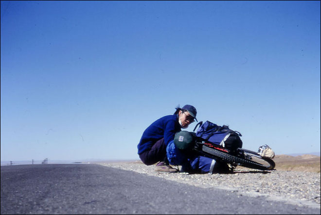 Liyang, digs out some raisin and snacks for a road side break. Amdo, Tibet.