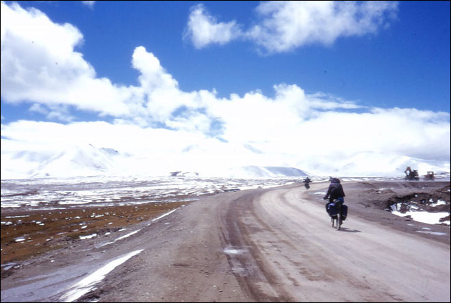 It is a constant bad to keeps the roads in usable shape. Sections of the route were newly paved and other sections were being rebuilt Amdo, Tibet.