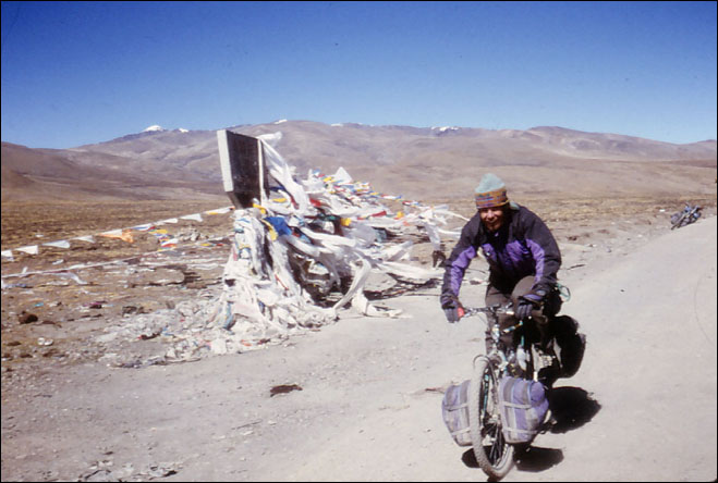 Ray celebrating after having climb one more pass. Lhatze, Tibet.