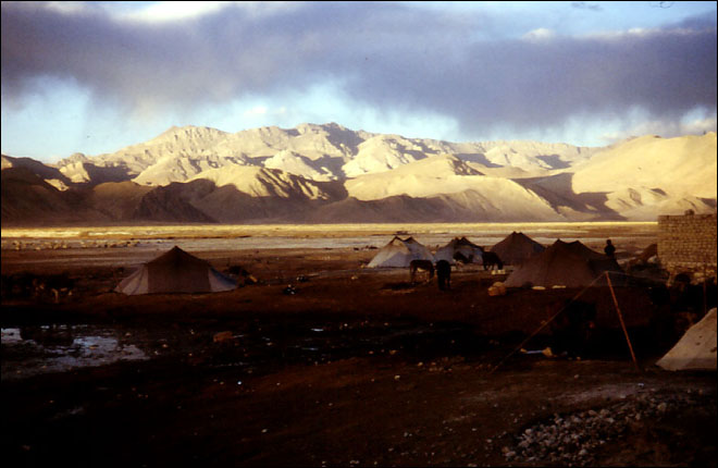The nomads just set up camp behind the hotel, it is cheaper that getting a room. Tingre, Tibet.
