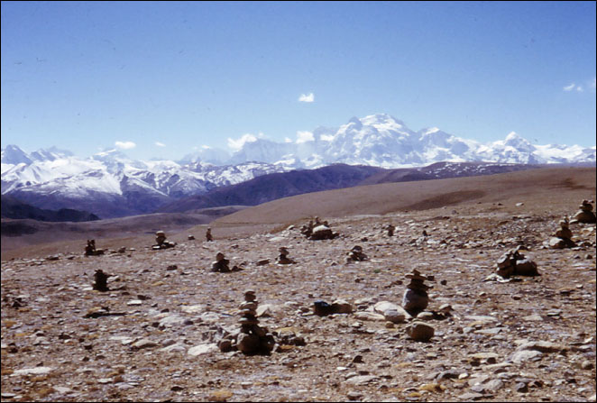 Small stone markers are left as offerings at the tops of passes all over the Himalayan region. La Lung La, Tibet.