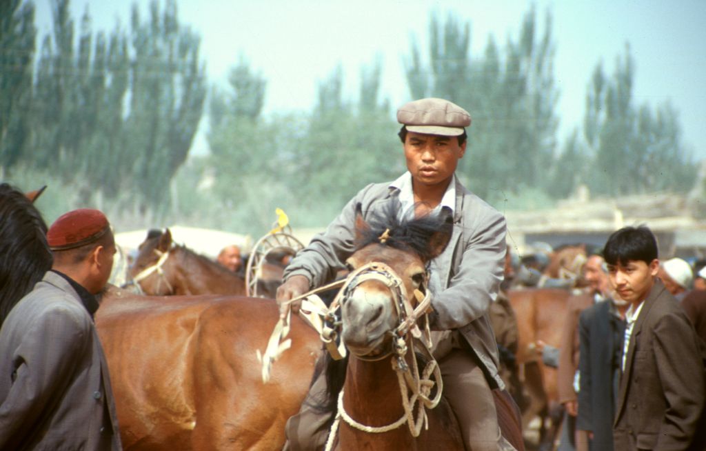 Test driving a horse at the Sunday Market. Kashgar, Xinjiang, China.