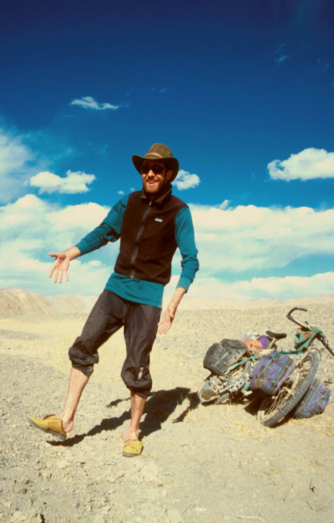 John trying on a pair of road side shoes. Askin Chin, Xinjiang, China.