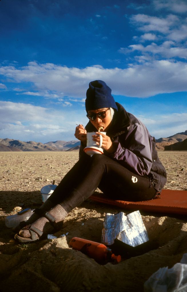 We would take turns using the stove (center bottom of the photo, in the foil) to cook our meals. Most evenings we ate noodles with whatever else we could find to throw in. During these days the road side vegetables that we had found a couple days before were a welcome treat. Askin Chin, Xinjiang, China.
