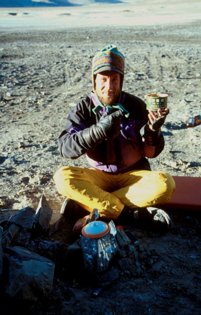 Ray, holding up one of the dinner ingredients. Yum... Chinese Army surplus pork fat in a can. Just like mom used to make! Askin Chin, Xinjiang, China.