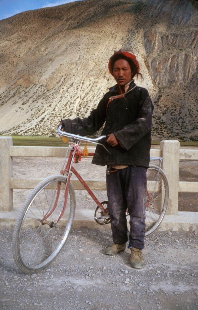 It was always a welcome sight to see another cyclist. Without any gears on his bike he must have had a rather tough time of it. Tingri, Tibet.