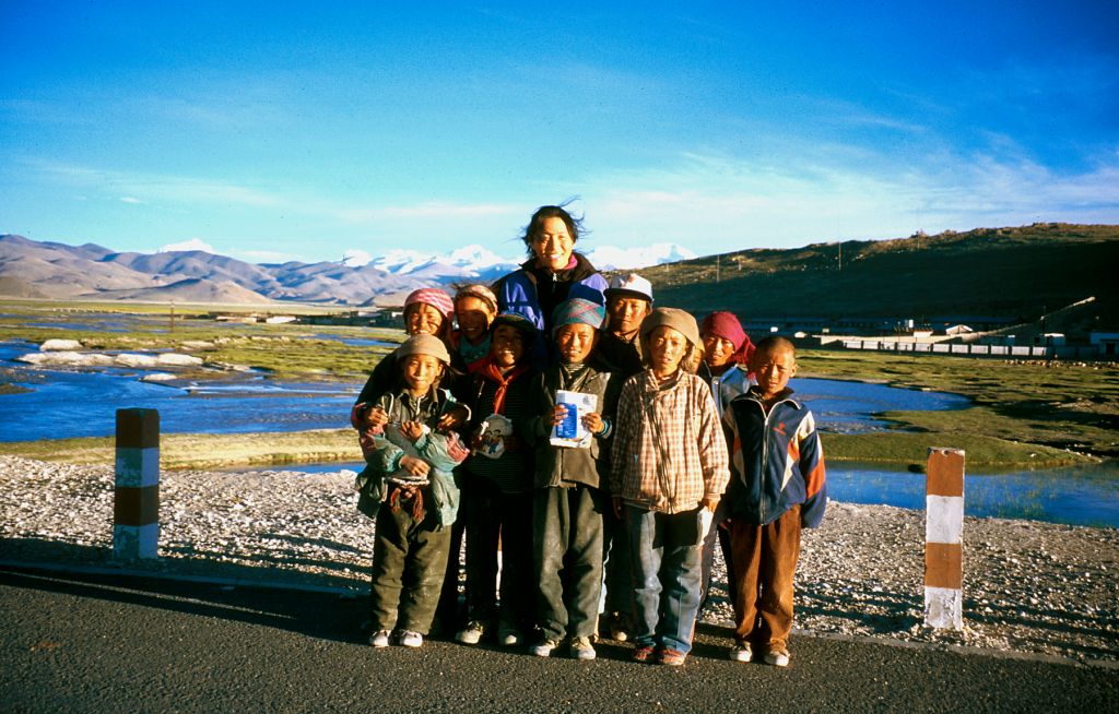 Liyang, with a gang of dirty Tibetan children that came out to see what we were up. Tingri, Tibet.