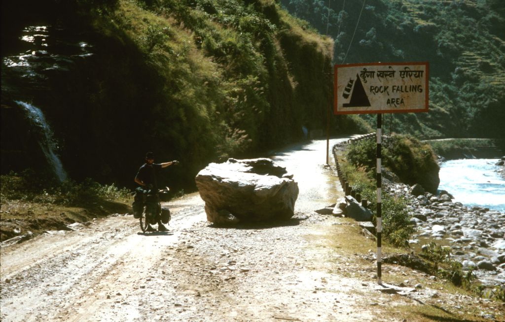 John points out what the sign was trying to alert us to, "Rock Falling Area." Barabise, Nepal.